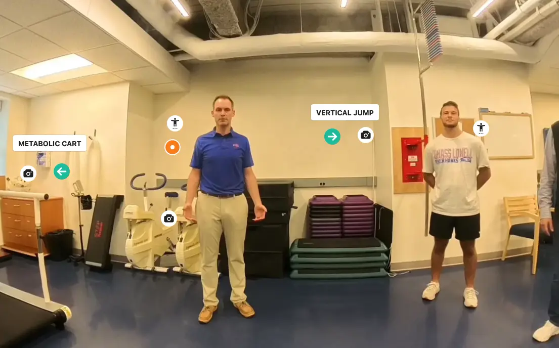 Screengrab of ThingLink Lab tour with two men and arrows leading to Metobolic Cart and Vertical Jump stations