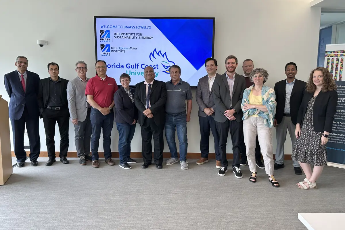 Faculty from UML and FGCU pose for a photo.