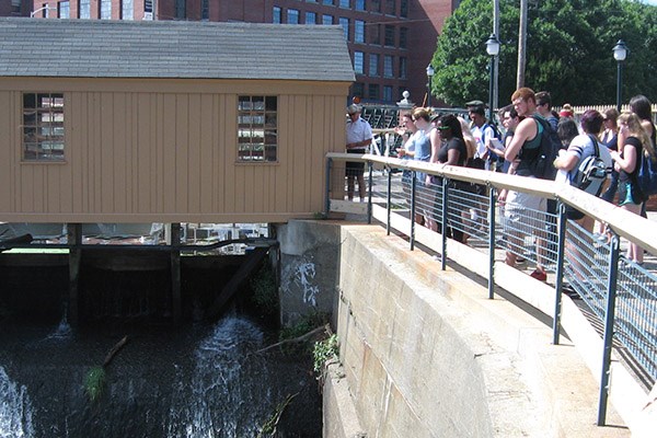 First-year Honors College students check out the Swamp Locks Gatehouse in Lowell