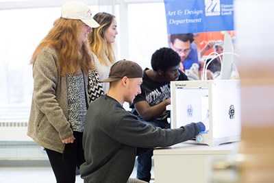 Students use a 3-D scanner in the new Fab Lab