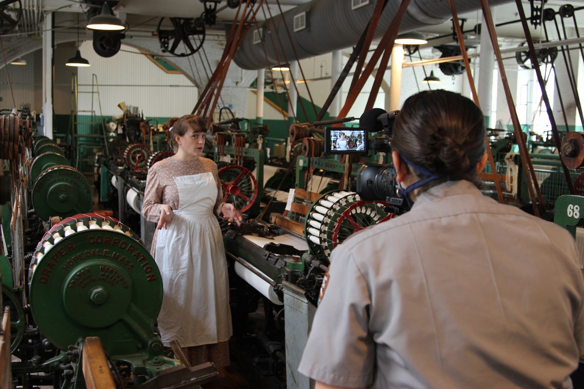 Lowell National Historical Park interpretation ranger Allison Horrocks enacts a mill girl on a virtual field trip