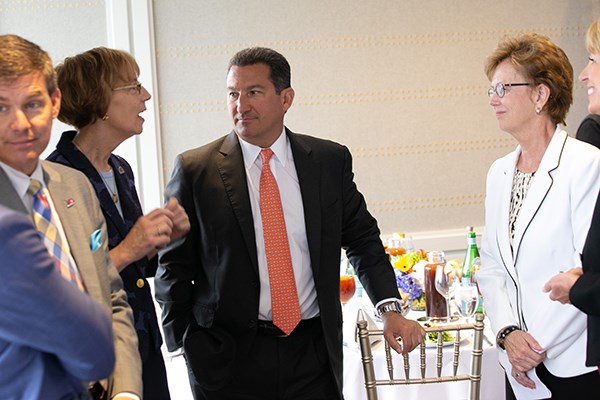 Deb Finch chats with Rob Manning and Jacquie Moloney at the luncheon