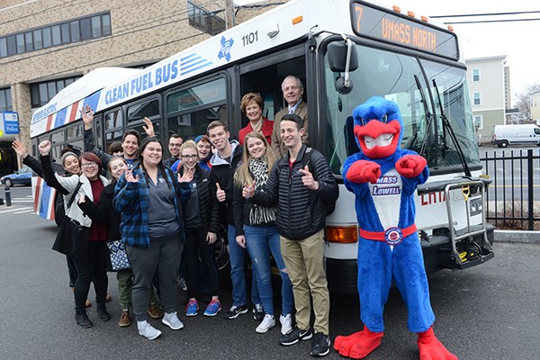 Jacquie Moloney and students pose with an LRTA bus