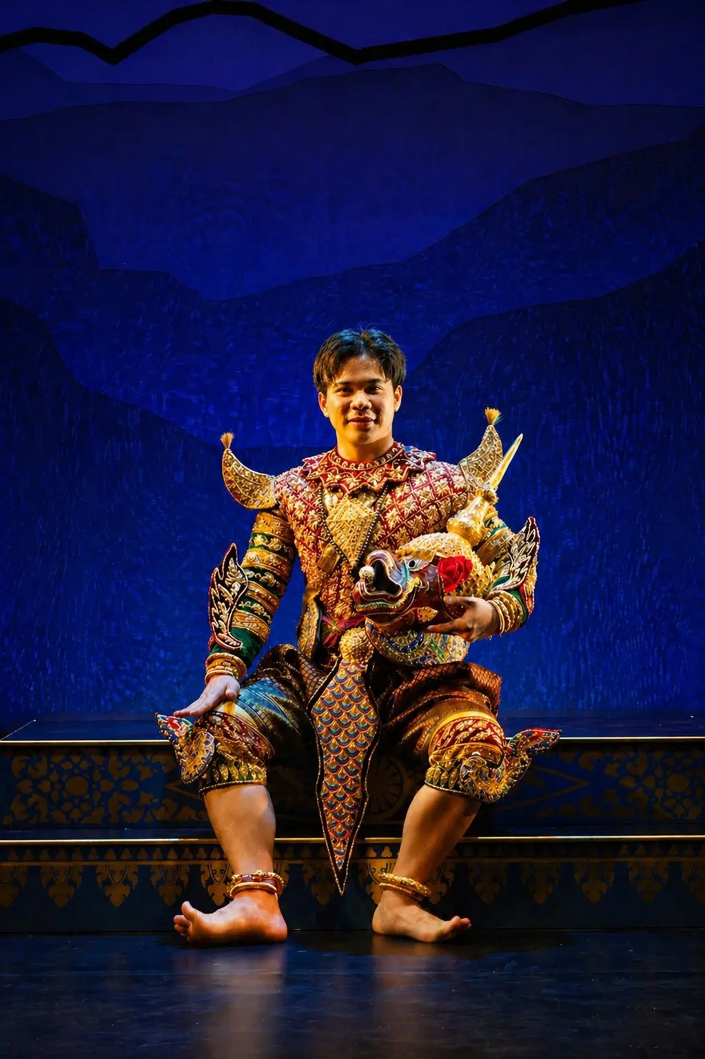 Chummeng Soun in a colorful Khmer dance costume with mask removed