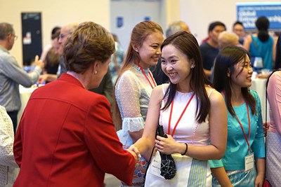 Chancellor Jacquie Moloney greets a visiting GE2 student 