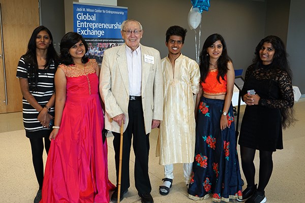 Manning founder Stuart Mandell poses with visiting students