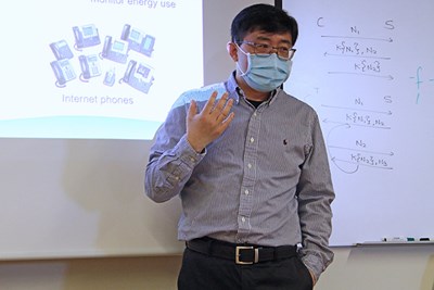 CS Prof. Benyuan Liu giving a talk