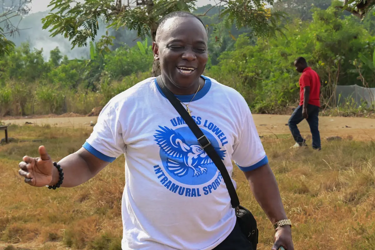 man in UMass Lowell Intramural Sports T-shirt outside