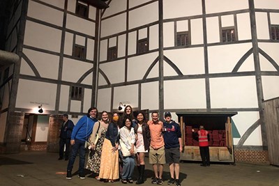 Honors student Baz Warren, center of back row, and friends outside Shakespeare's Globe theater in London