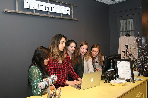 Students work with Ani Vong in Humanity Boutique