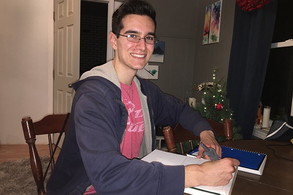 UMass Lowell student Kyle Mehan works on his final project in Graphic Novels for Science and Medicine