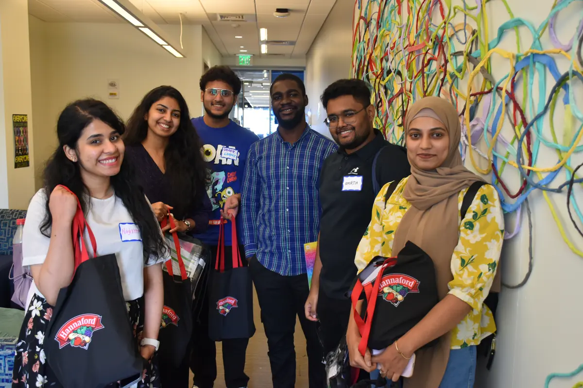 Group of international students in the UMass Lowell Office of Multicultural Affairs' office.