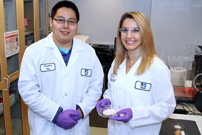 Asst. Prof. Gulden Camci-Unal and her student in the lab