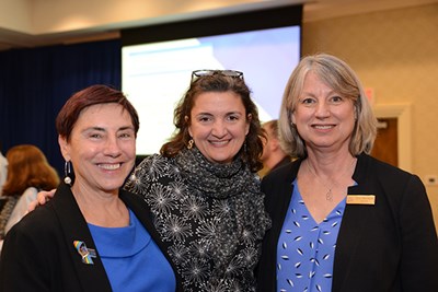 Art Assoc. Prof. Ingrid Hess, center, at a faculty event with Tsongas Industrial History Center Director Sheila Kirschbaum, right, and Associate Dean for Health and Wellness Paulette Renault-Caragianes