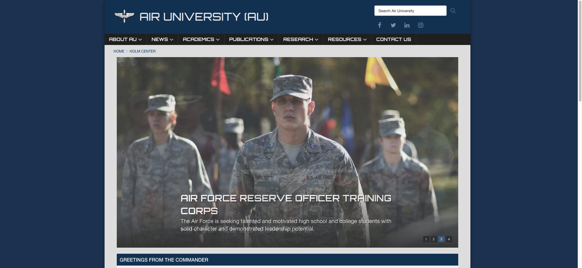 An image from the Holm Center (Air University) website showing several members on uniform and the website homepage/text.