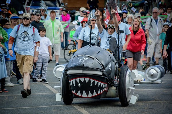 Jay Hungate steers his contraption during Lowell first kinetic sculpture race.