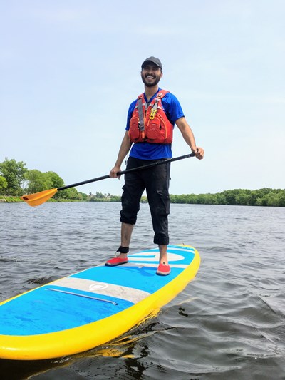 Stand-up Paddle Boarder smiling.