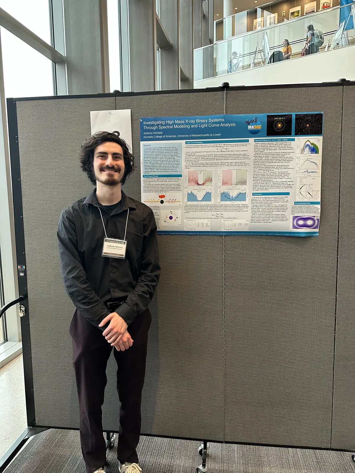 Anthony DeVasto presents his poster "Investigating High Mass X-ray Binary Systems Through Spectral Modeling and Light Curve Analysis".