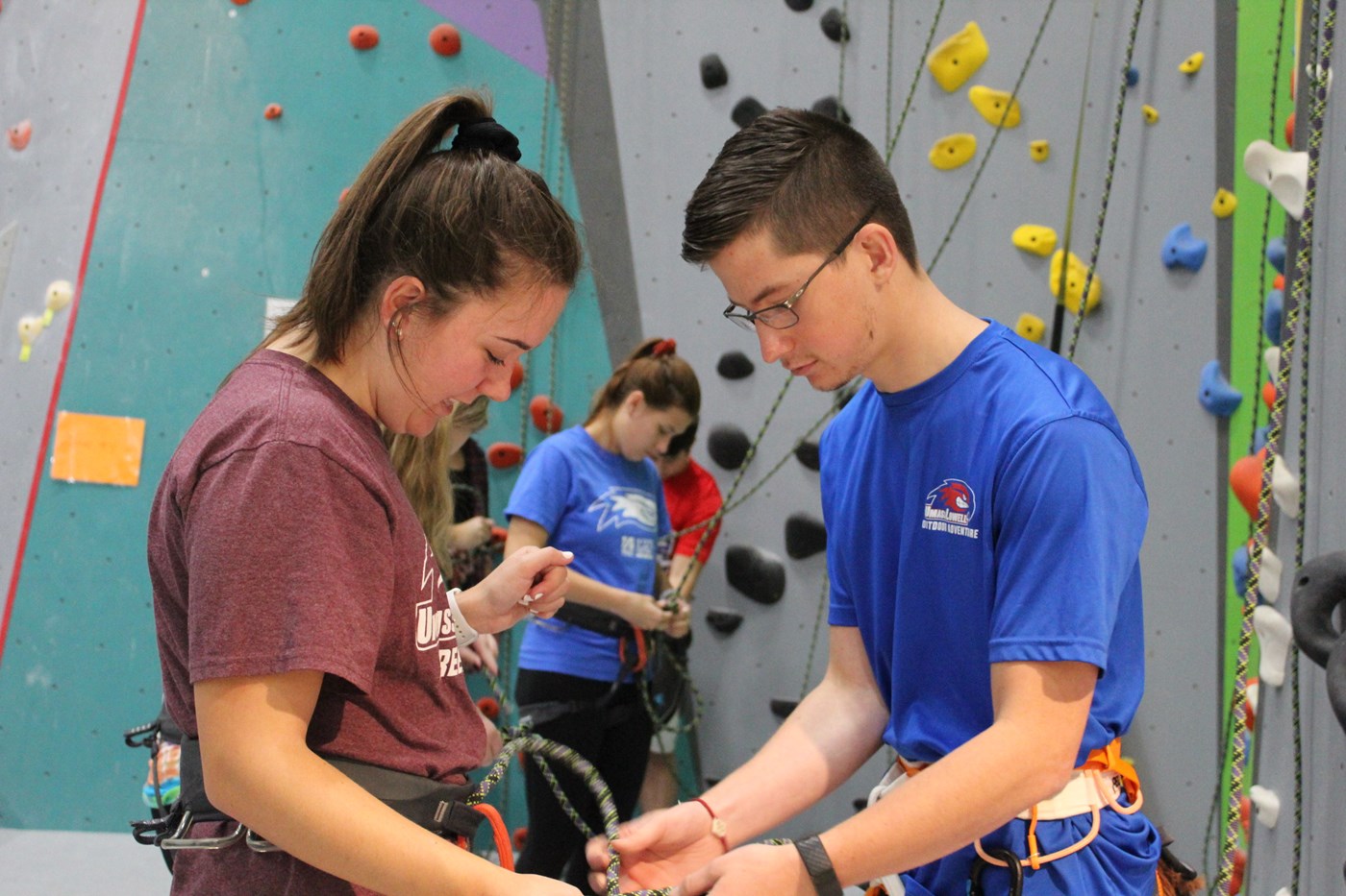 Two students climbing at Indoor Rock Climbing gym.