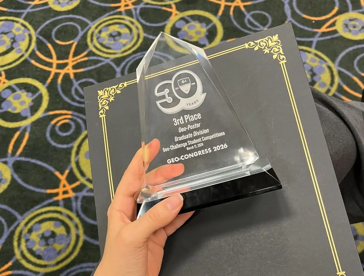 Hand holding 3rd Place National GeoPoster Competition award at GeoCongress 2026.