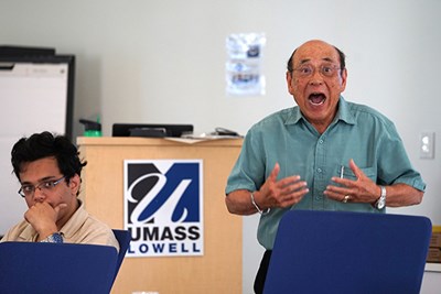 Emeritus Prof. Jay Lam talks to international students about the importance of speaking English