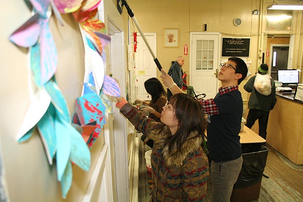 International students volunteer at the Lowell Transitional Living Center