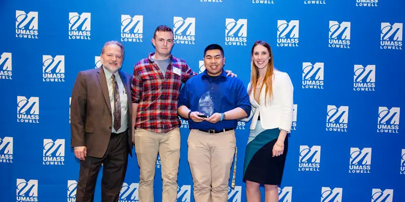 George Le and Peter Maitland onstage with Steve Tello, Holly Butler and their 2018 Idea Challenge Campus-wide DifferenceMaker award for Iron Legion