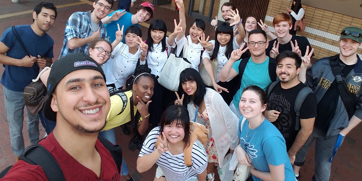 James Joutras poses with a group of students in Japan