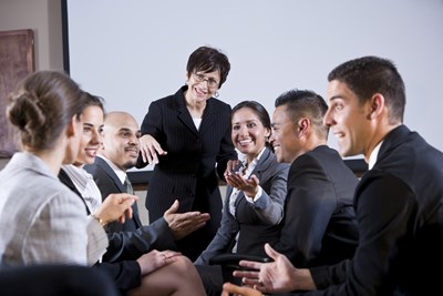 Group of happy employees sitting around a table. FOR EMPLOYERS Take steps to control job stress by addressing organizational policies, job design, and social supports.