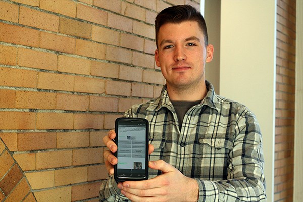 Joshua Bedard holds his "Study Break" app