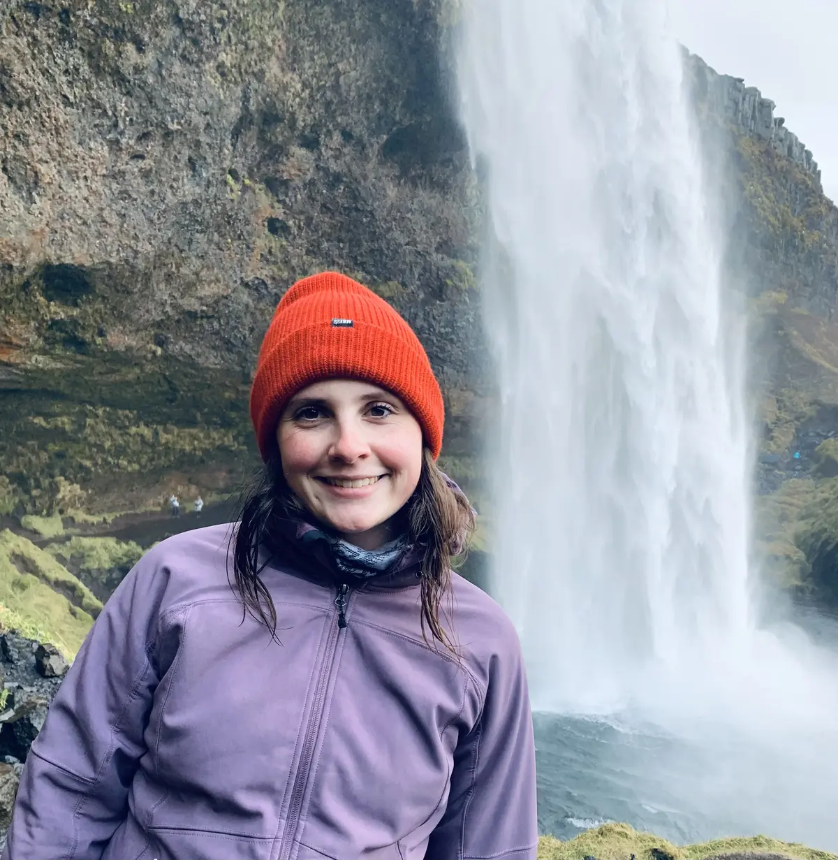 Kale Connerty in front of a waterfall.