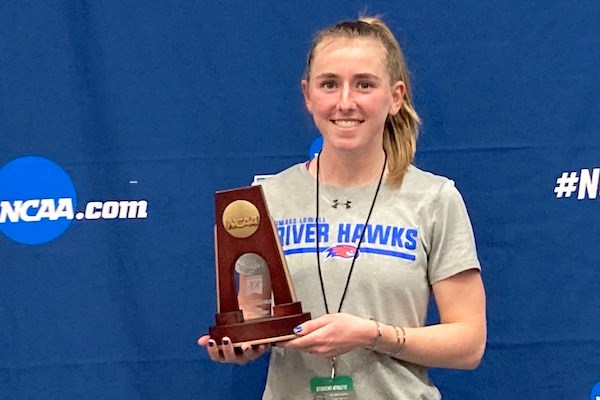 Kaley Richards holds her indoor track All-American award