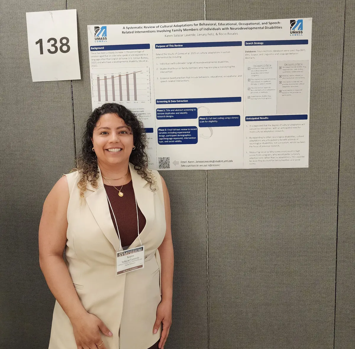 Karen Salazar Laverde in front of her poster