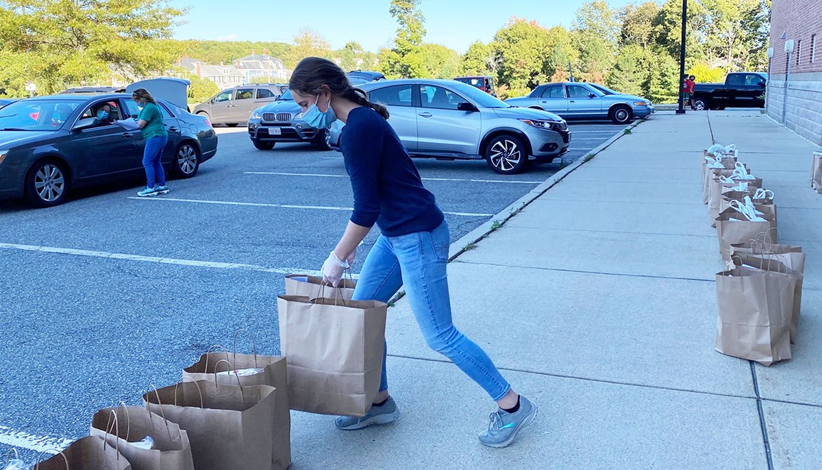 Kate Killion loaded grocery bags onto sidewalk
