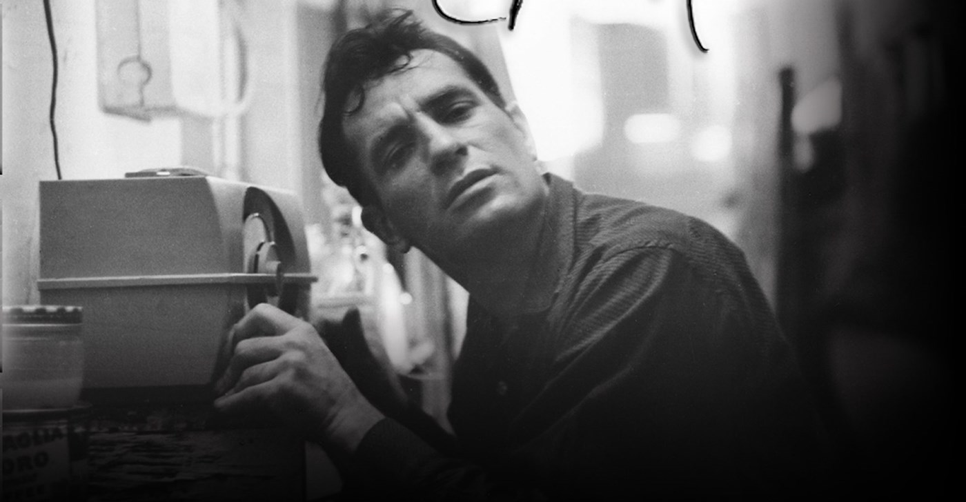 Jack Kerouac sitting at a radio.