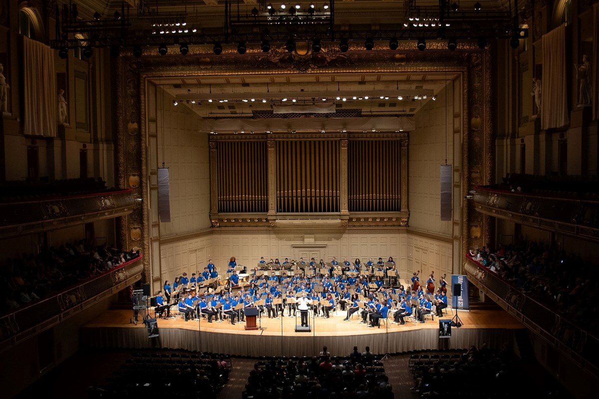 UMass Lowell Symphonic Band Camp performs at Symphony Hall in Boston.