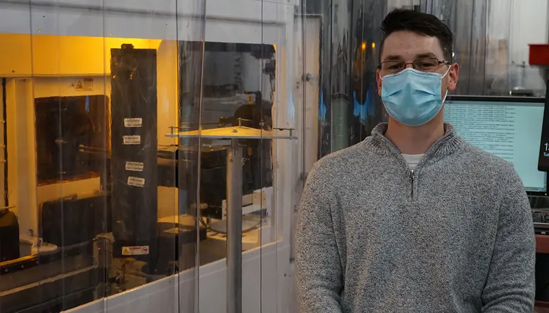 Kevin Twitchell wearing a mask at his job at Brooks Automation