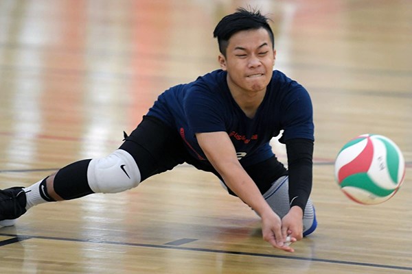 Jackie Kho digs the ball during tryouts