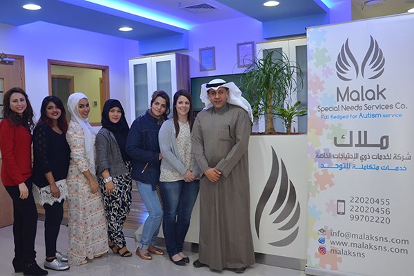 Devon White with Hesham Alebrahim and the staff of Malak Special Needs Services in Kuwait City
