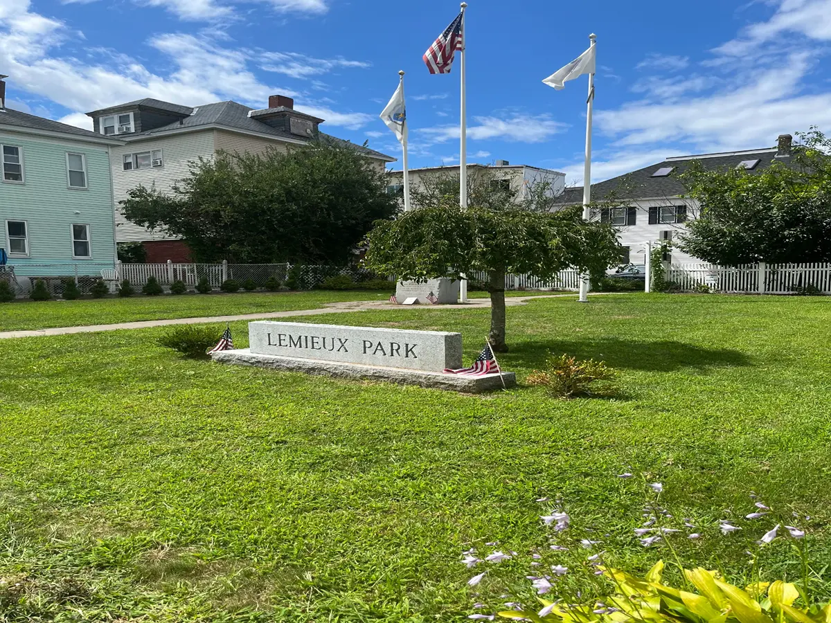 Granite marker on the grass of Walter Lemieux Memorial Park.
