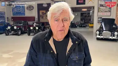 Jay Leno inside his automotive garaage