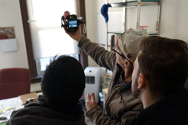 Orhan Kallogjeri and Tu Anh Huynh learn how to use a thermal imaging camera