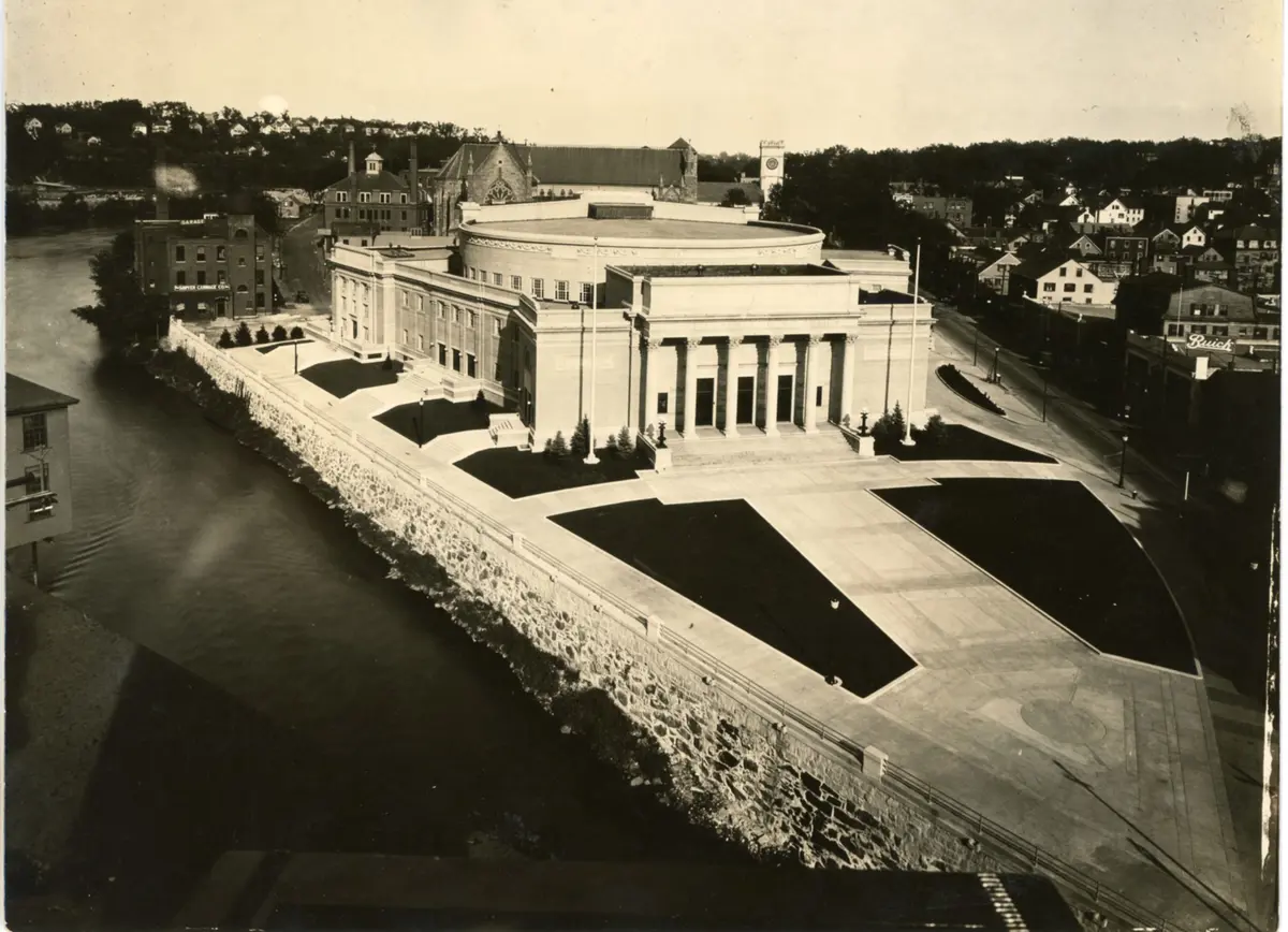 Historical aerial photo of the front of and right side of the Lowell Memorial Auditorium building and grounds.