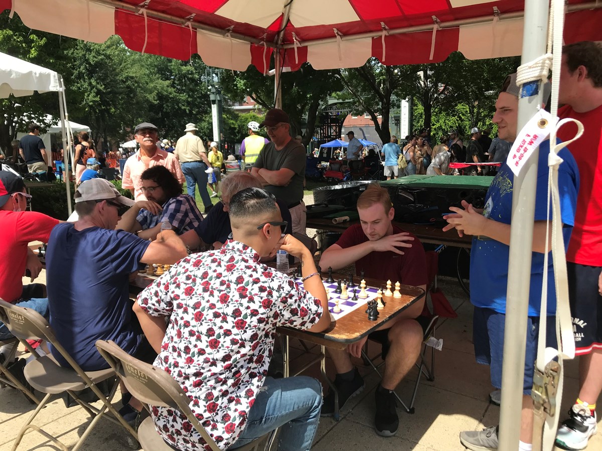 Lowell Chess Club playing outdoors