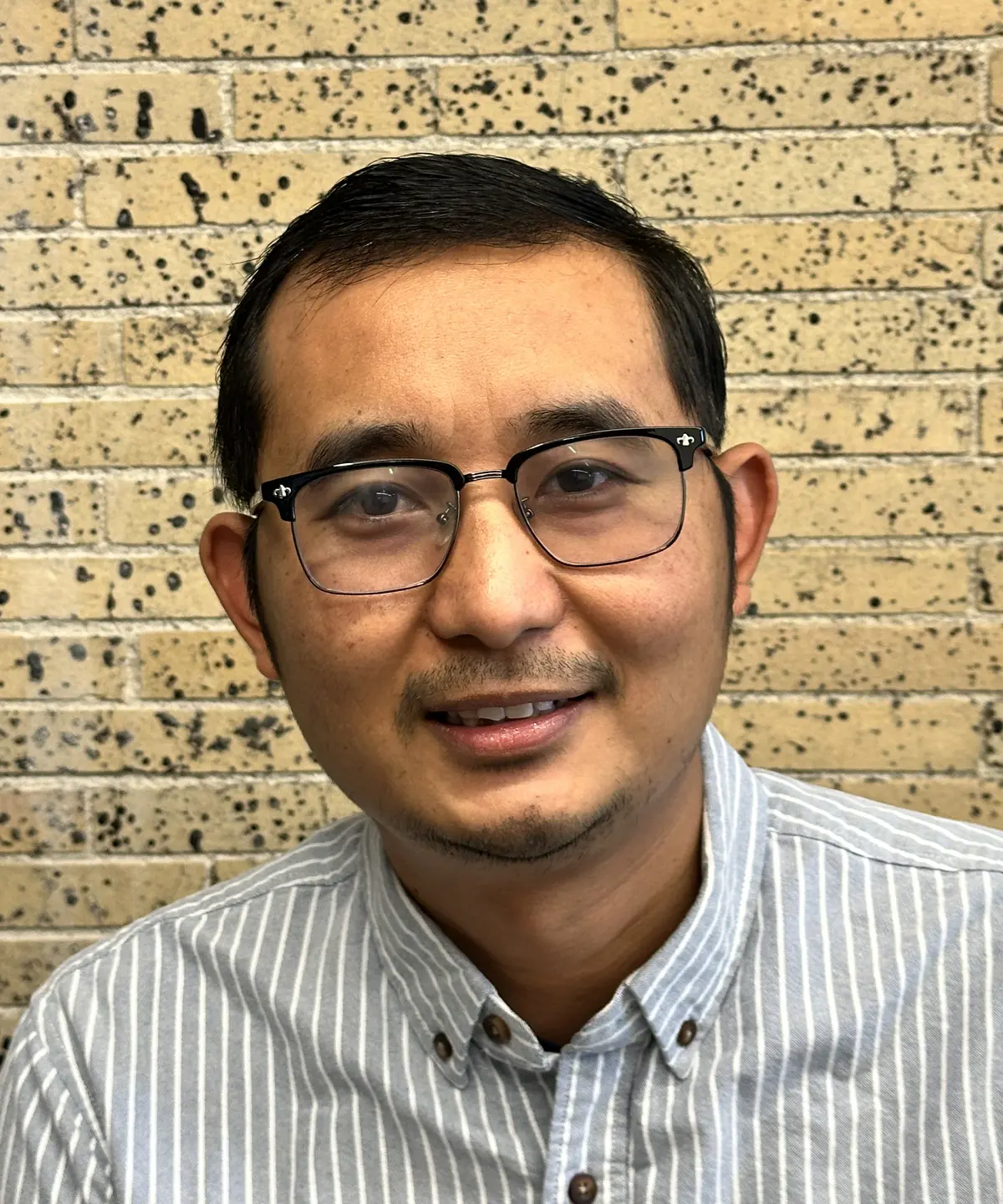 Portrait of Lugyi No in Coburn Hall at UMass Lowell