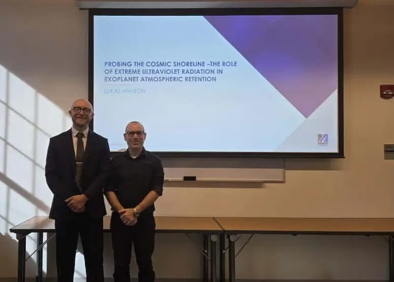 Graduate student Lukas Hanson with Professor Ofer Cohen during PhD defense titled Probing the Cosmic Shoreline.