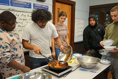 Students at The Career Academy in Lowell, MA, take part in a cooking class taught by staff from Mill City Grows
