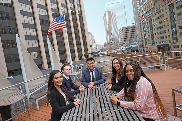 Manning School of Business students, from left, Lena Astarjian, Zachary Mizioch, Christopher Sheng, Nicole Resendes and Philecia Smith-Rise visit MFS Investment Management's headquarters in Boston during the final weeks of their remote co-ops with the global financial services firm.