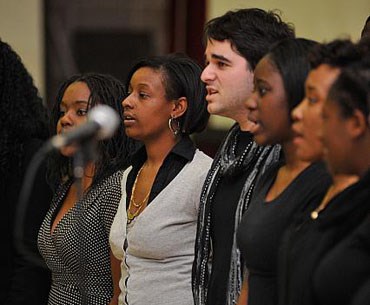 Umass Lowell Choir group, preforming a choir at an event. 