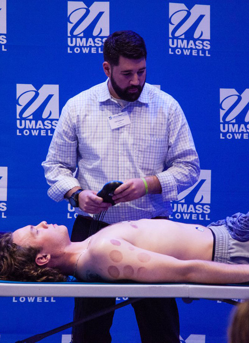 A member of the Mass Heartbeat team presents to DifferenceMaker judges and demonstrates their screening technique